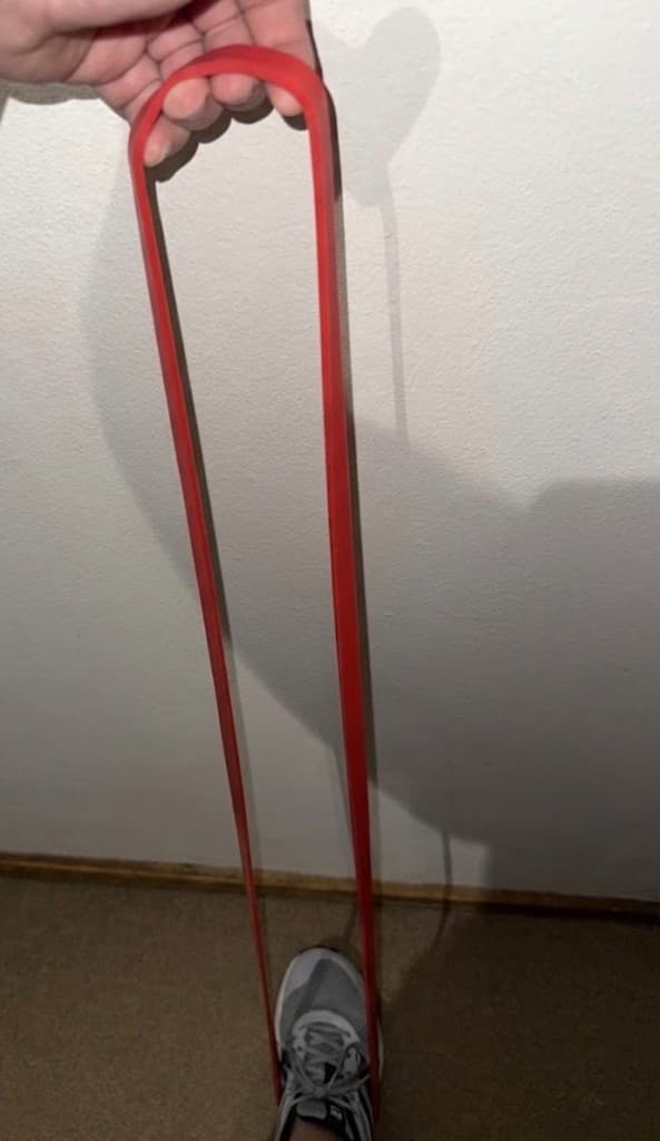 Ruck & Run resistance band stretched for training indoors